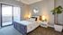 Furnished bedroom with patio