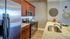 Kitchen with stainless steel appliances and wood cabinets