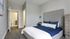 Furnished bedroom with attached bathroom
