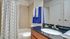 Bathroom with one sink, toilet, and shower