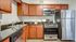 Kitchen with stainless steel appliances and wood cabinets