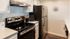 Arrive Alexandria Kitchen with Stainless Steel Appliances and White Cabinetry