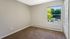 Vacant bedroom with large window