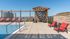 Rooftop pool with lounge chairs
