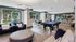 Clubhouse with seating, pool table, and kitchen