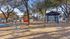 Dog park with trees and dog obstacles