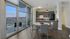 Dining room table and kitchen with balcony