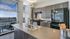 Kitchen with black appliances and wood cabinets