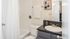 Bathroom with one sink, toilet, and shower