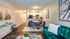 Furnished living room, dining room, and kitchen view