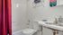Bathroom with one sink, toilet, and shower
