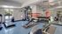 Fitness center with cardio and weight machines and free weights