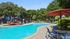 Pool with lounge chairs and umbrellas