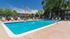 Pool with lounge chairs and umbrellas