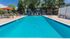 Pool with lounge chairs and umbrellas
