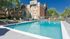 Pool area with lounge chairs
