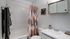 Alturas Andrews Modern Bathroom Furnished with Sink, Toilet, and Shower