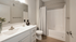 Arrive Loring Park Bathroom with Vanity and White Countertops
