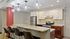 Arrive 4301 Clubhouse Kitchen with Barstool Seating and Modern Lighting
