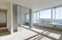 bedroom with floor to ceiling windows