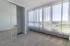bedroom with floor to ceiling windows