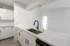 kitchen with stainless steel appliances and white cabinets