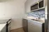 kitchen with stainless steel appliances and white cabinets