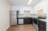 Arrive Clairemont Kitchen with White Cabinetry and Stainless Steel Appliances