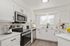 kitchen with stainless steel appliances and white cabinets