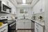 kitchen with stainless steel appliances and white cabinets