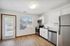 kitchen with stainless steel appliances and white cabinets