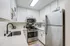 Arrive Santa Clarita Kitchen with White Cabinetry and Stainless Steel Appliances