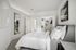 furnished bedroom with walk-in closet