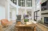Arrive Chadds Ford Clubhouse TV Lounge with High Ceilings and Chairs