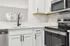 Arrive Crofton Modern Kitchen with White Cabinetry and Stainless Steel Appliances