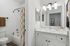 Arrive Buckhead Bathroom with Vanity and Modern Lighting