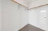888 at Grand Hope Park Spacious Walk in Closet with Wooden Rods