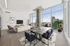 888 at Grand Hope Park Dining Area Overlooking Living Area with Floor-to-Ceiling Windows