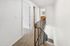 Alturas Vose Townhomes Upstairs Hallway with Gray Carpet and White Walls