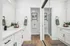 Arrive Rolling Oaks Bathroom with White Cabinetry and Mirror Closet Doors