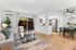 Arrive Rolling Oaks Living Room with Natural Lighting and Connecting to Kitchen