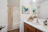 Alturas Vose Townhomes with Wooden Cabinets and Vanity Mirror