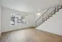 Alturas Vose Townhomes Bright Open Living Room with Wood Flooring and Staircase