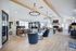 Bright and airy community lounge featuring modern decor, comfortable seating, and entertainment options.