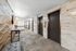 Arrive 800 Penn Elevators with Modern Light Fixtures and Gray Carpet