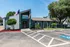 Inviting leasing office with modern design and vibrant landscaping in a sunny neighborhood.