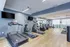Modern fitness center with state-of-the-art gym equipment including treadmills and ellipticals in a well-lit space.