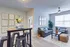 Bright and modern living space with stylish decor, featuring cozy seating and a contemporary dining nook.