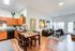 Bright and inviting open-concept kitchen and living room with modern decor.