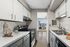 Arrive 800 Penn Modern Kitchen with White Cabinetry and Stainless Steel Appliances